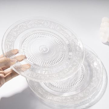 Elegant glass side plates featuring intricate embossed patterns, ideal for showcasing a vibrant assortment of fruits and snacks, enhancing the dining experience